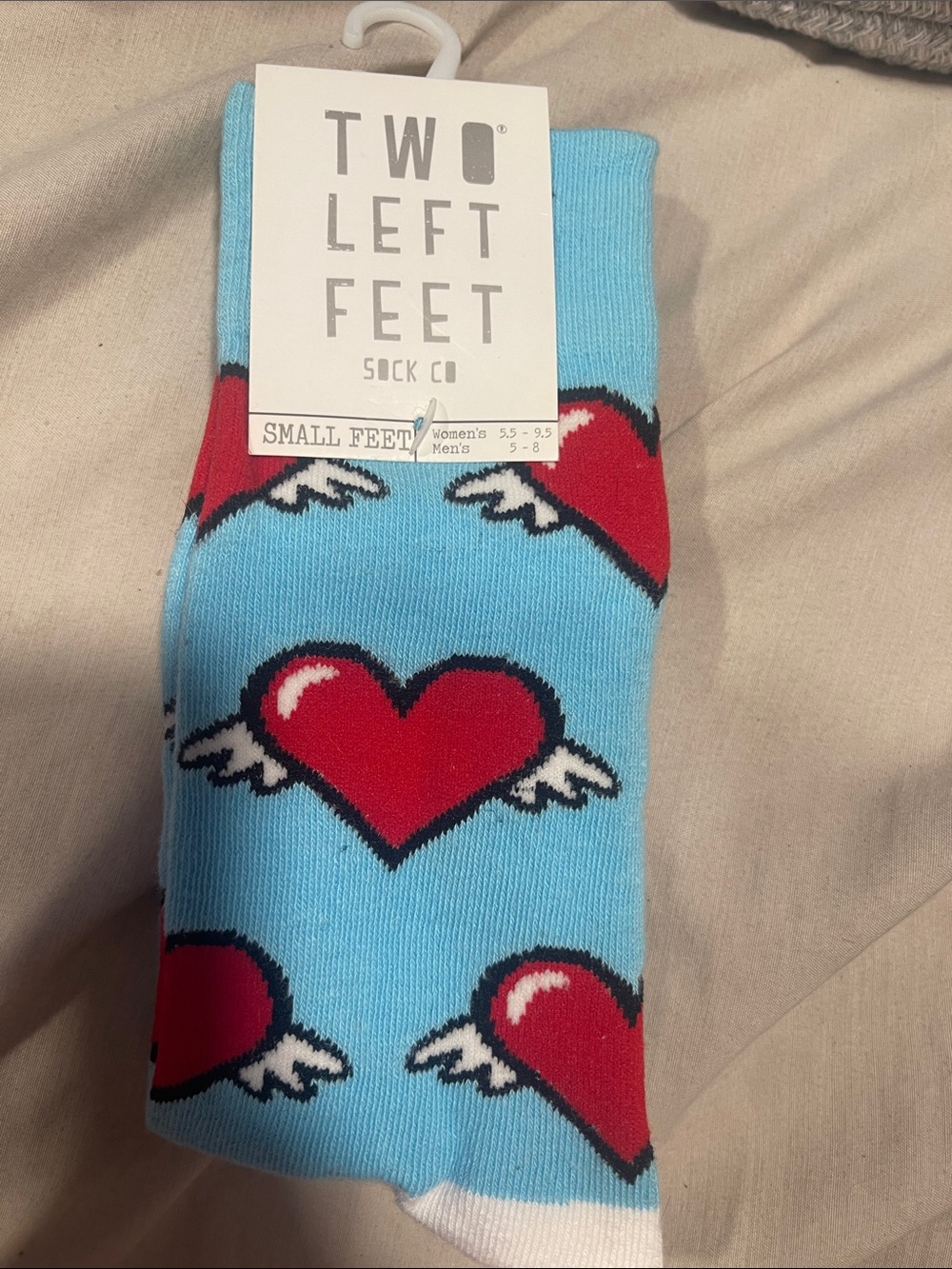 Two Left Feet Men's Light Blue Crew Socks with Red Winged Hearts